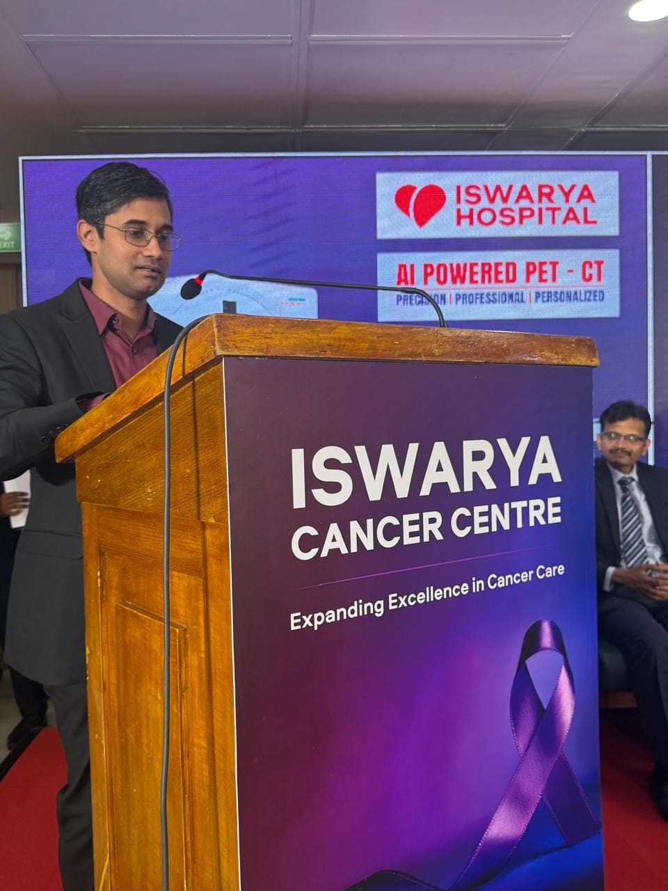 Dr. Varadharajan speaking at an Iswarya Hospital event